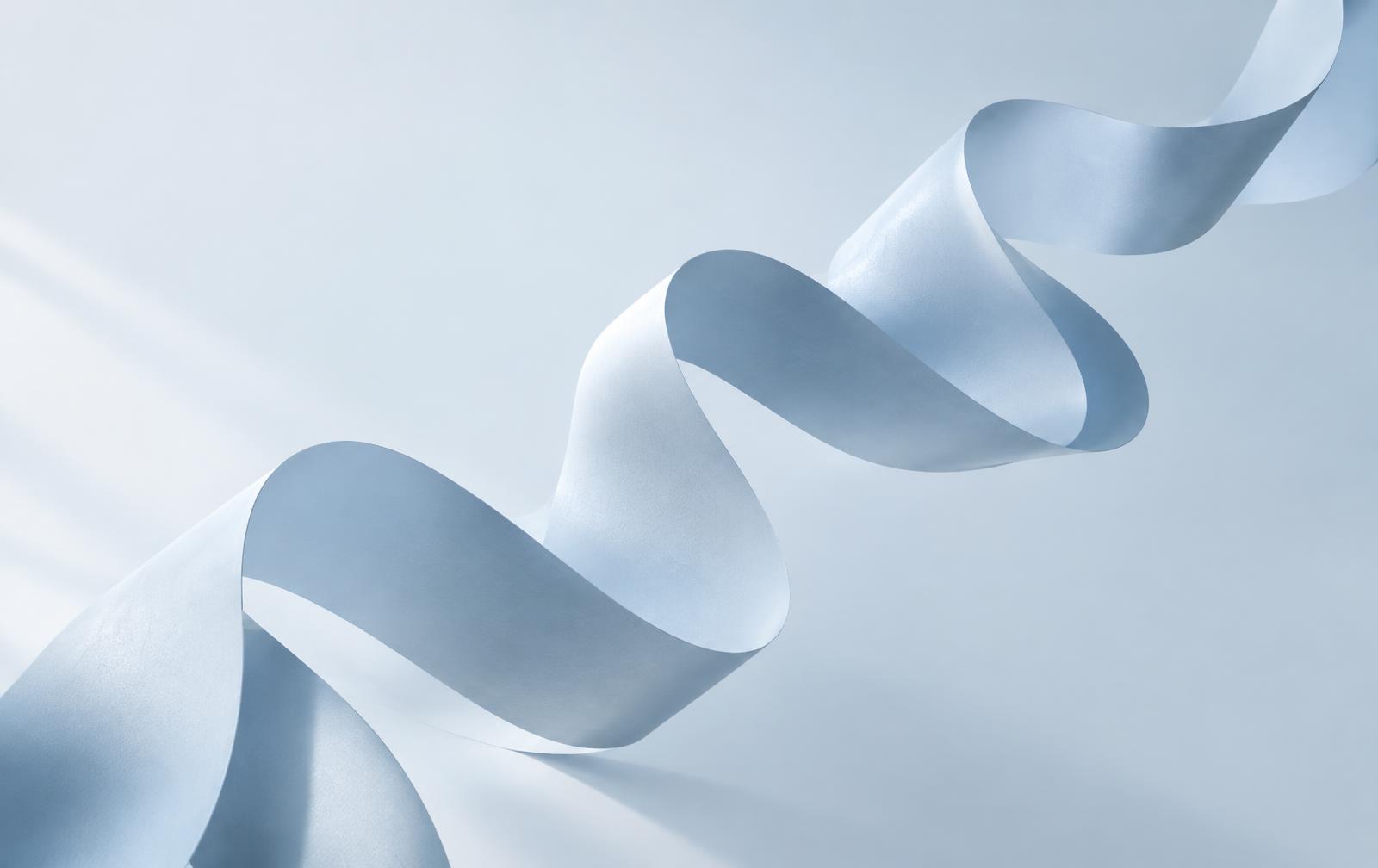 A flowing pale-blue paper sculpture